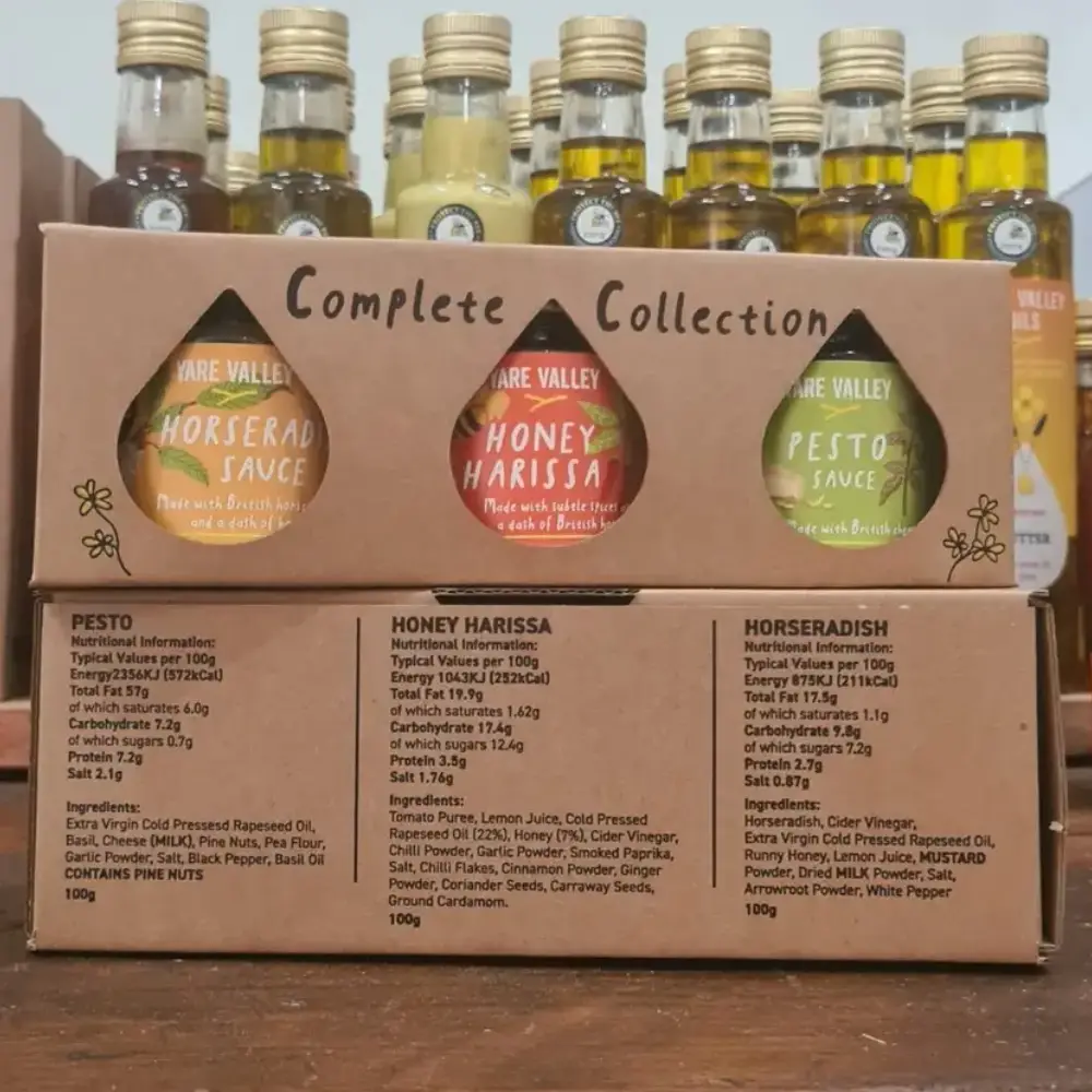 Yare Valley Oils complete collection gift set featuring horseradish sauce, honey harissa sauce and pesto sauce displayed in the farm shop.