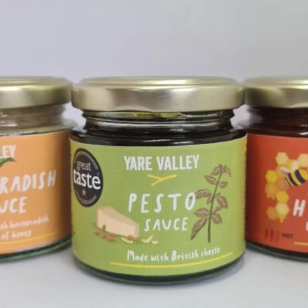 Close-up of Yare Valley pesto sauce jar made with British kale, shown alongside other Yare Valley sauces.